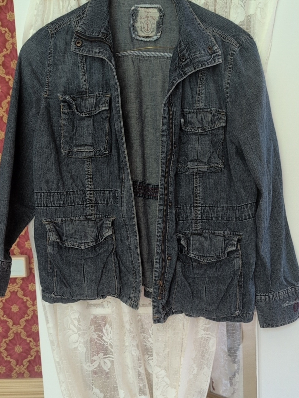 Jean Jacket With Both Zipper And Snap Closure.  Inside Drawstring For Added Styl